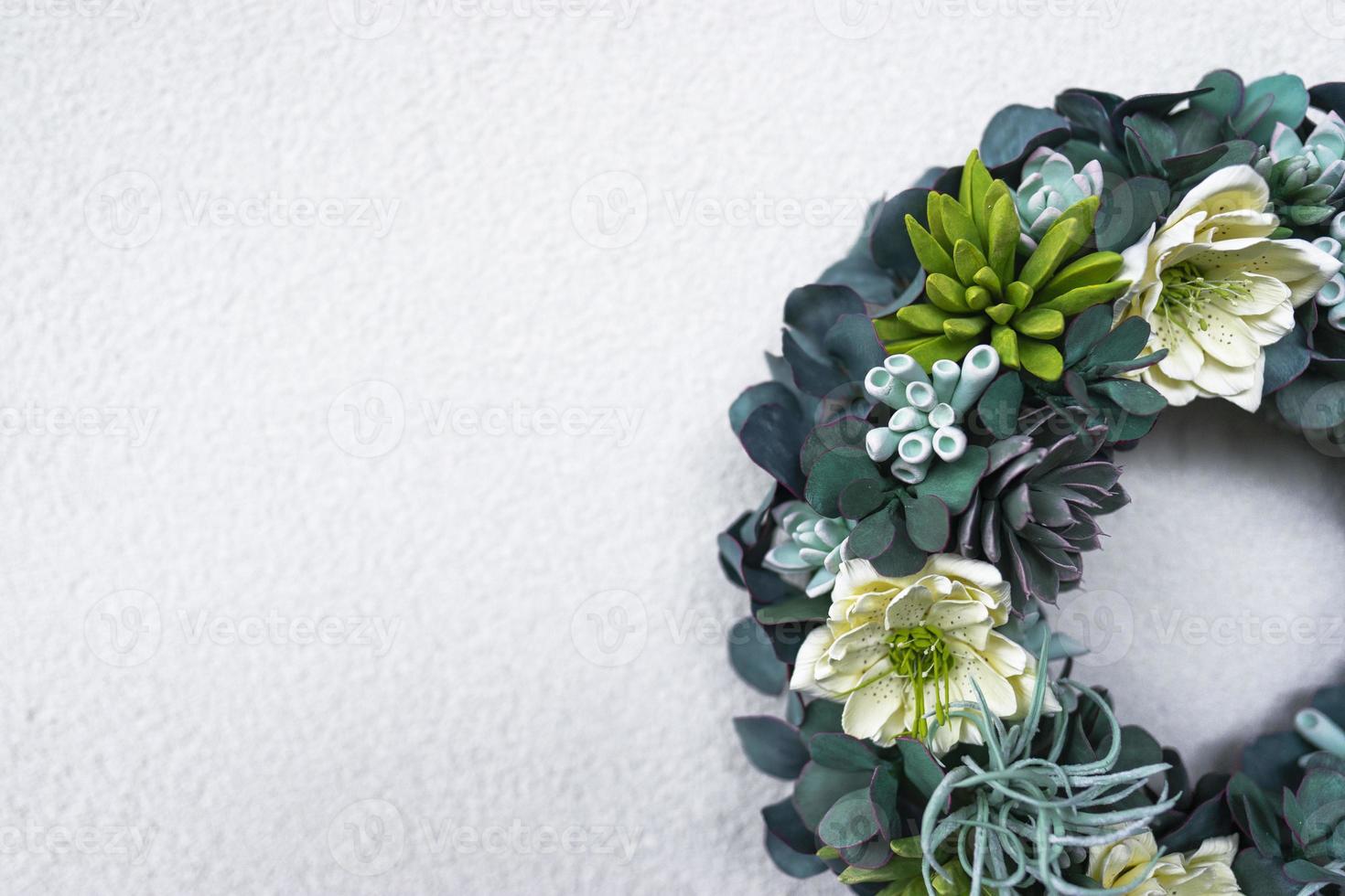 A wreath made of succulent plants decorates the interior of the modern apartment photo