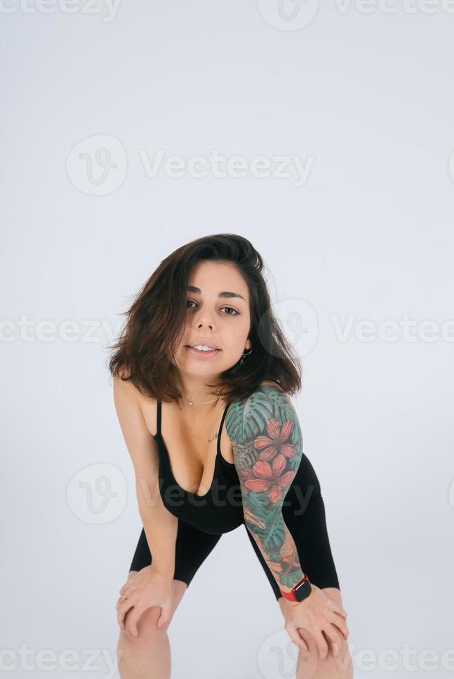 An ordinary young woman on a white background. Bodypositive concept. photo