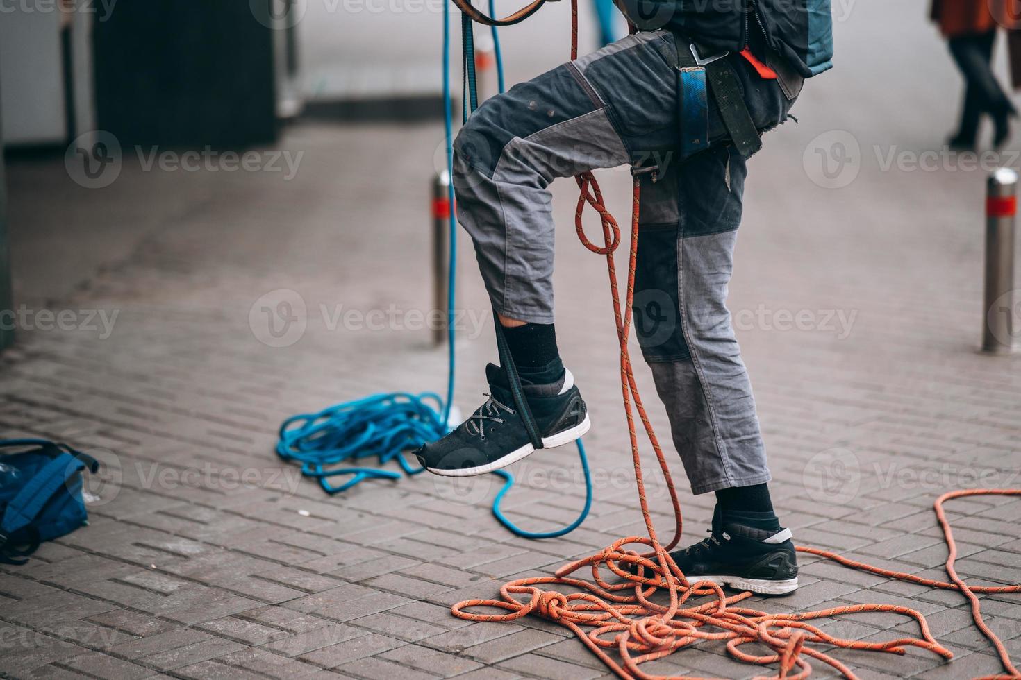 Worker climber preparing for work at height. photo