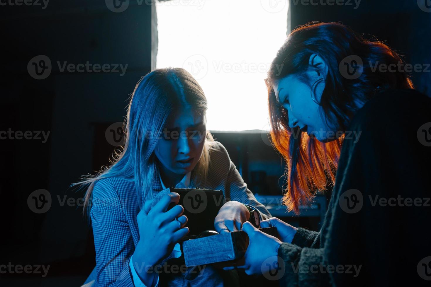 Woman and woman fortune teller with crystal ball photo