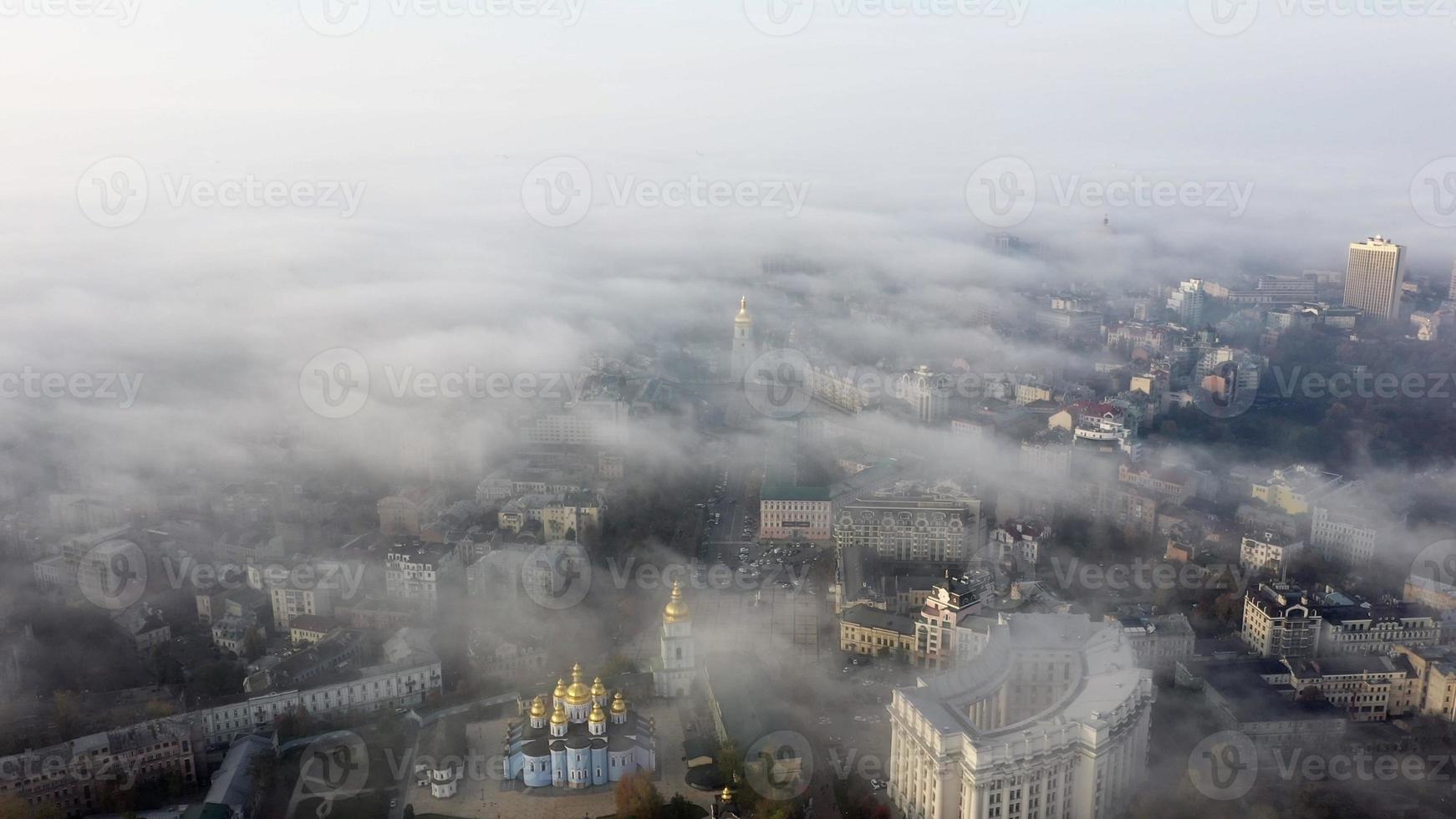 Aerial view of the city in the fog photo