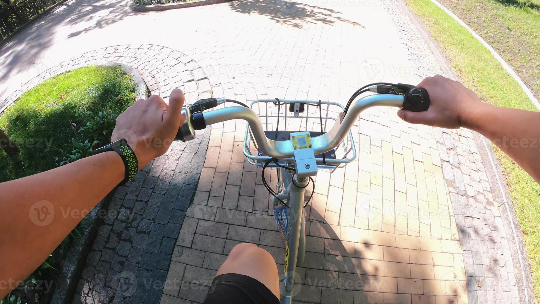 A view from the first person to the steering wheel, hands and road. photo