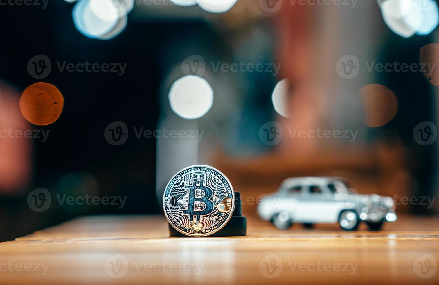 Silver bitcoin isolated on the table, glowing background photo