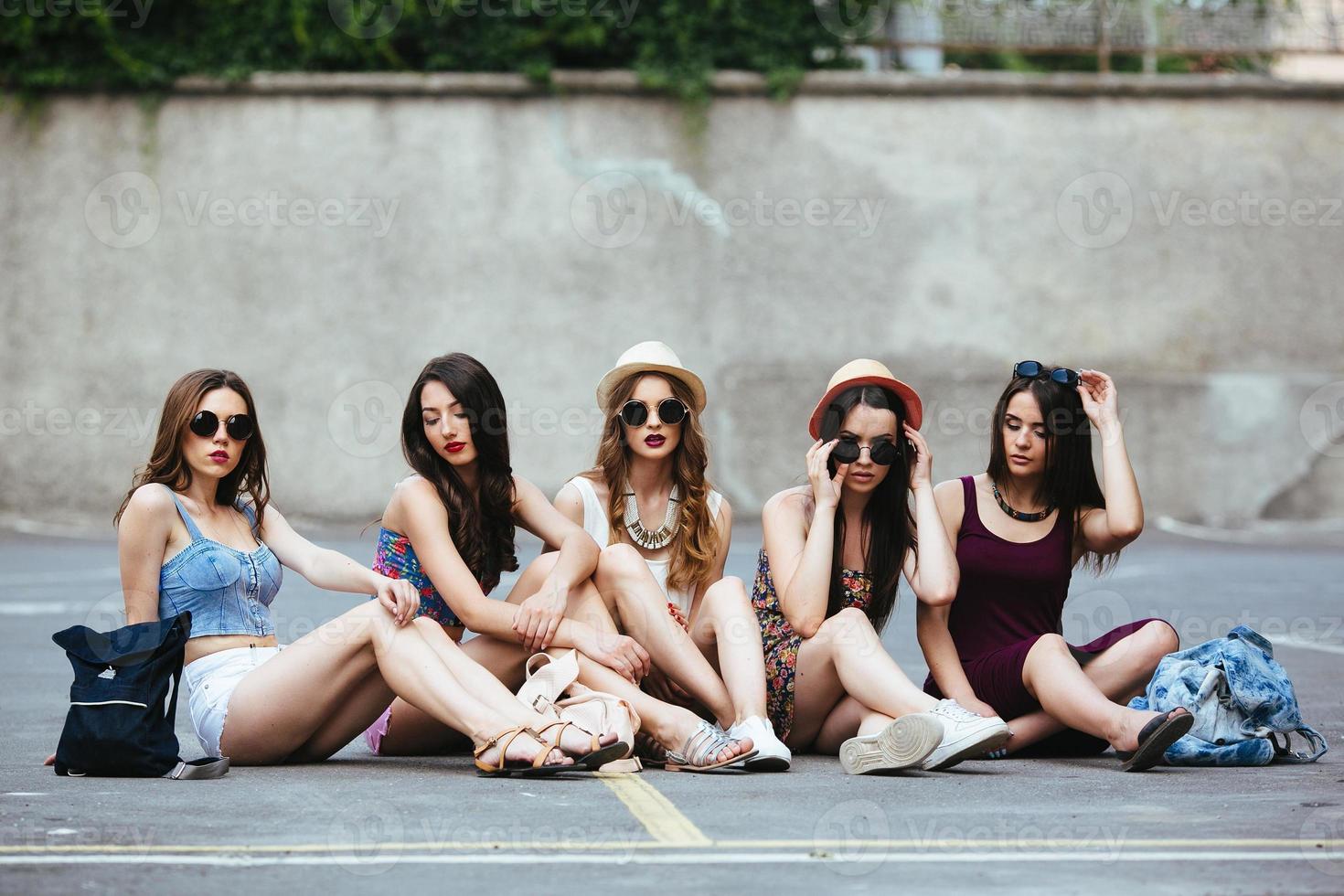 Five beautiful young girls relaxing photo