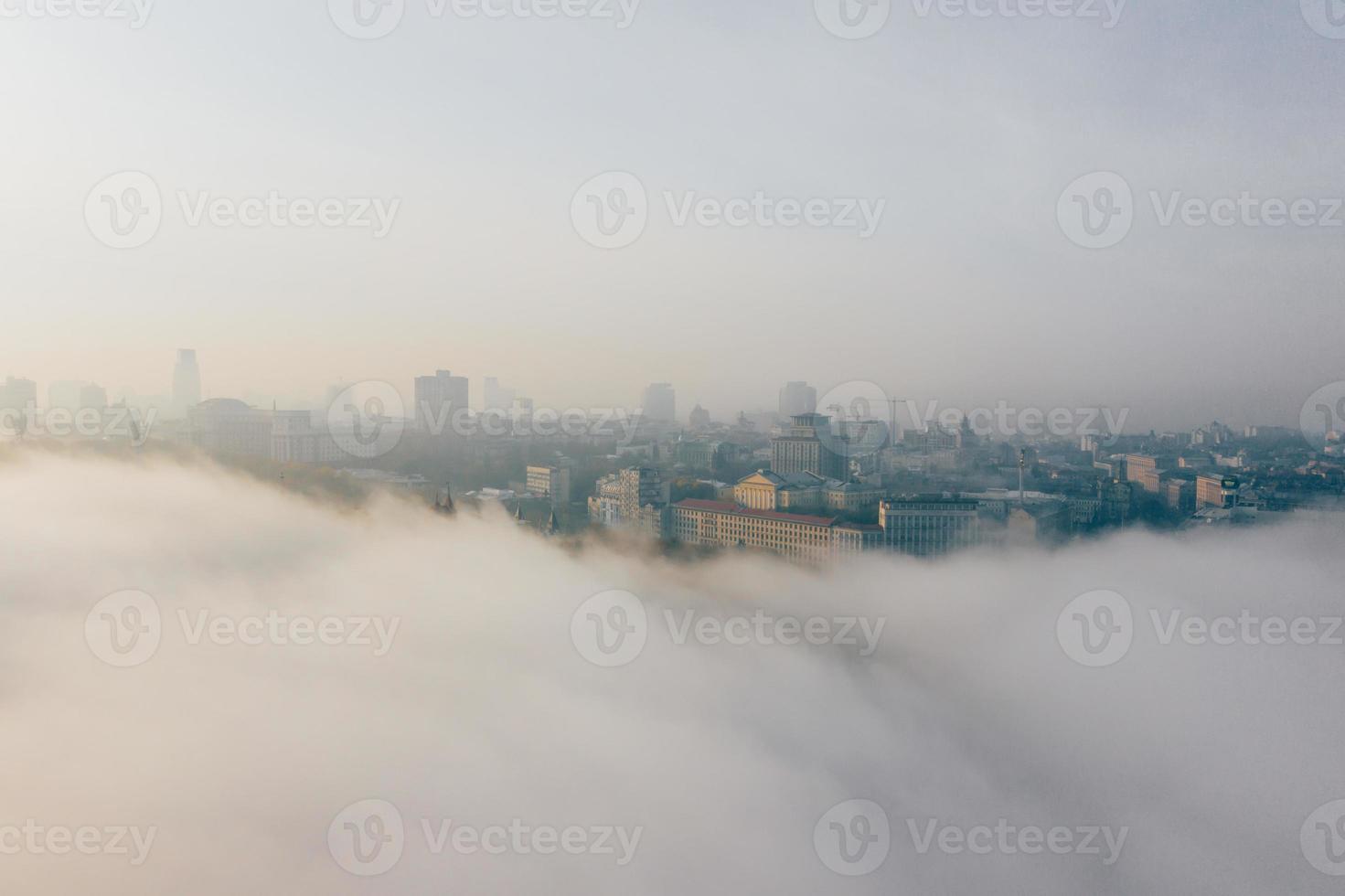 Aerial view of the city in the fog photo