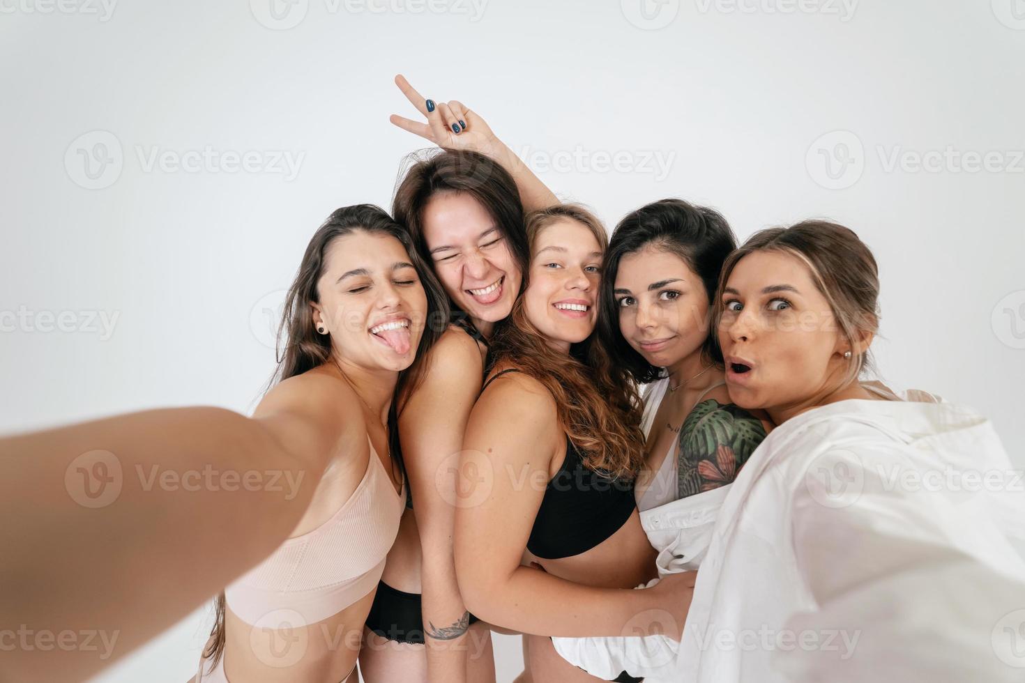 Diverse models wearing comfortable underwear take selfie photo