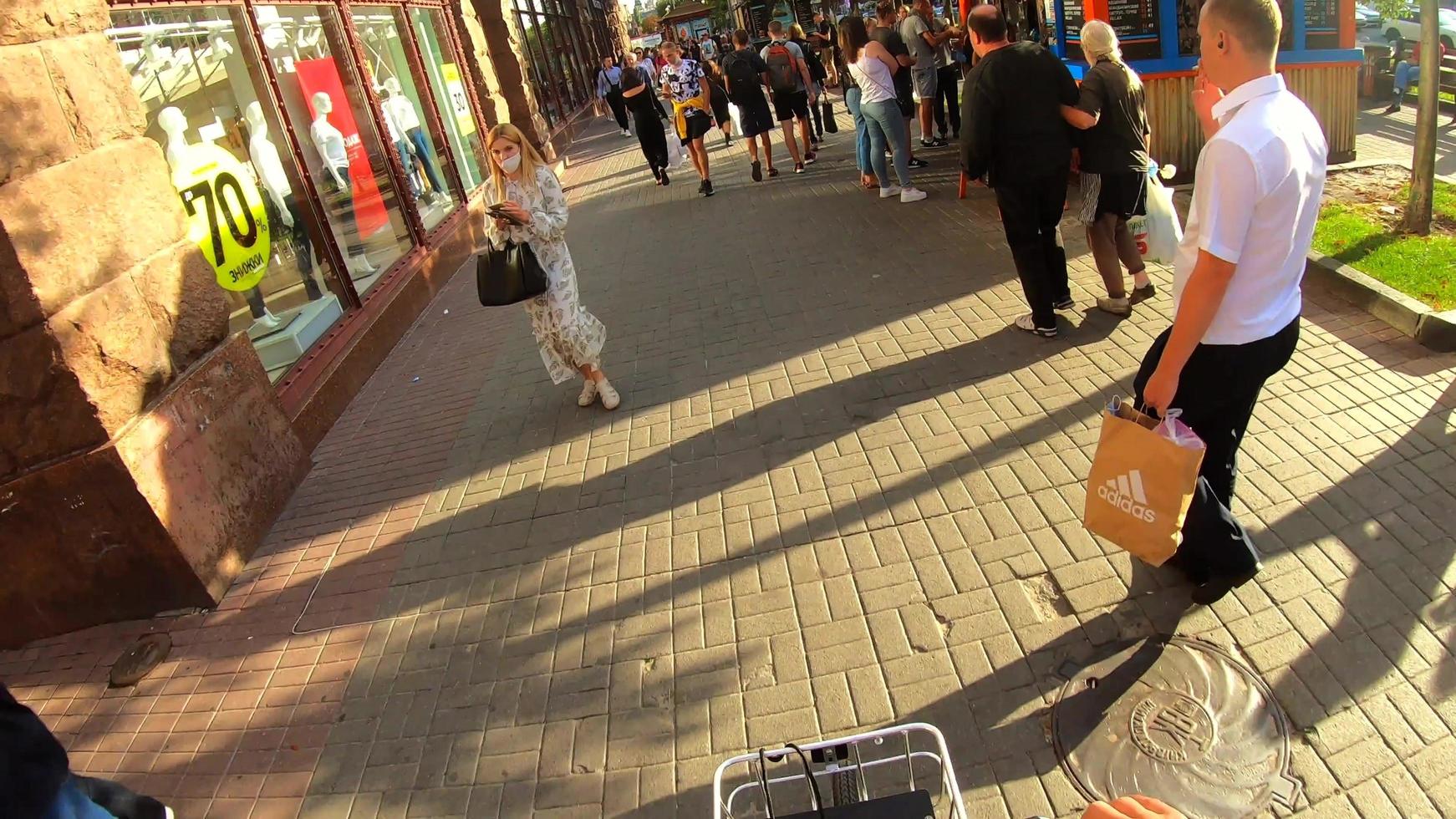 Kiev, Ukraine - May 21, 2021 First-person view. Man rides a bicycle in the Kiev photo