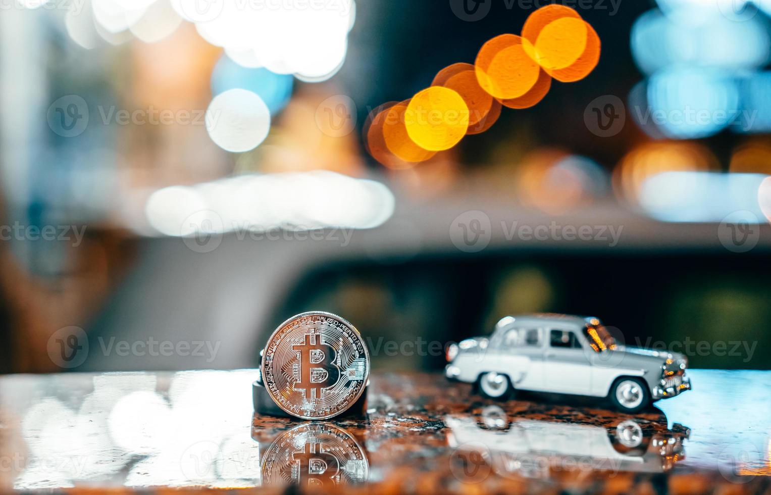 Silver bitcoin and Moskvich 401 on the table, glowing background photo