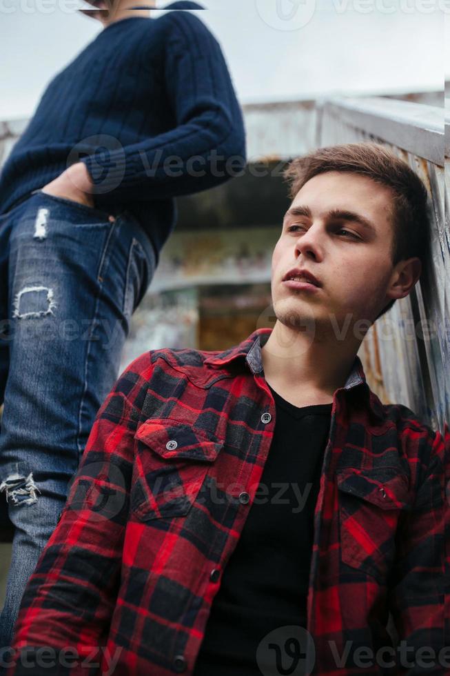 two guys stand in an abandoned building photo