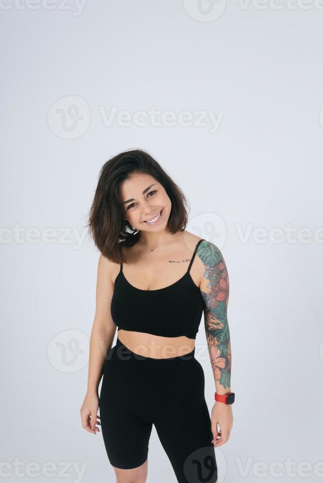 An ordinary young woman on a white background. Bodypositive concept. photo