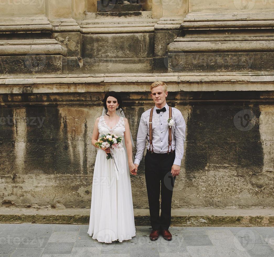 The bride and groom posing photo
