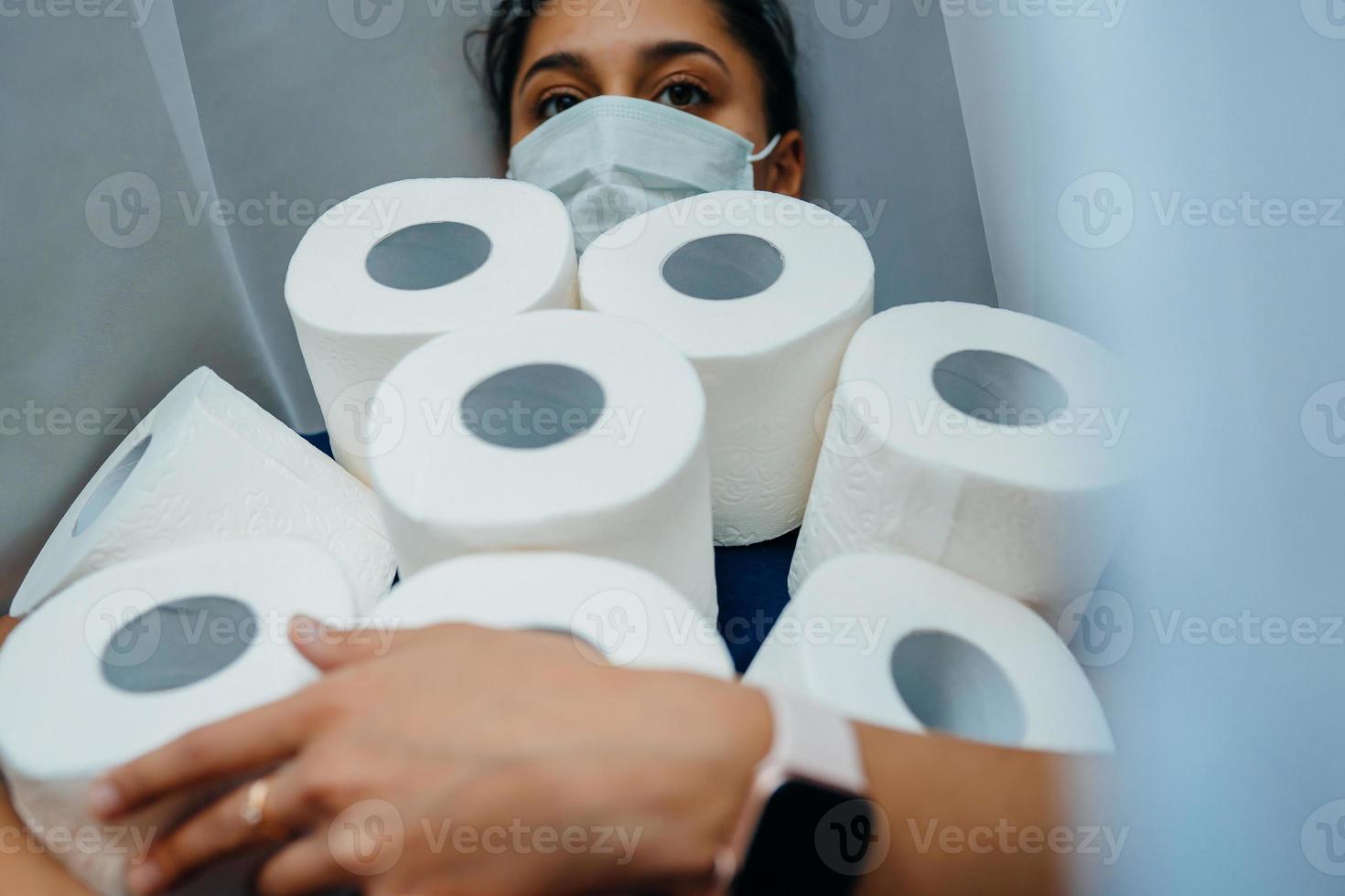 People are stocking up toilet paper for home quarantine from crownavirus. photo