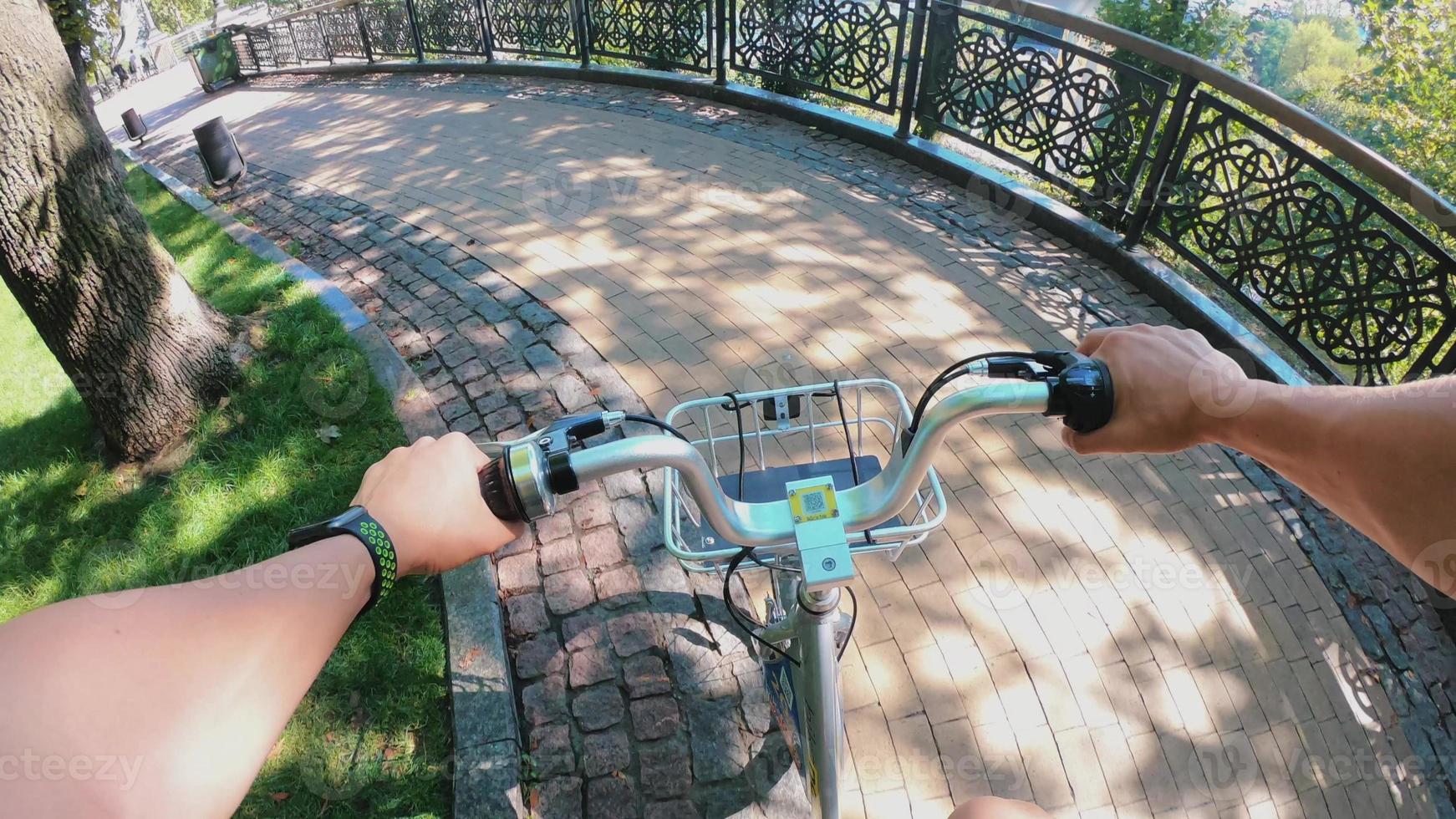 A view from the first person to the steering wheel, hands and road. photo