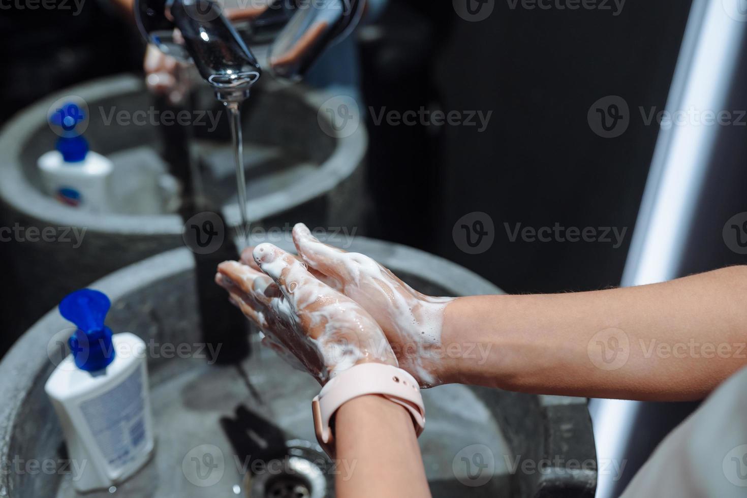 Man washing hands to protect against the coronavirus photo
