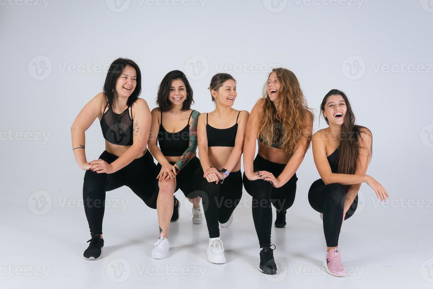 diverse models laughing, enjoying time together, look at camera photo