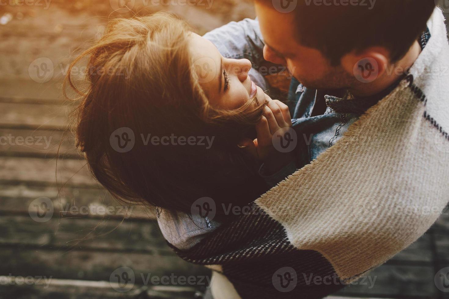 Young couple wrapped in plaid photo