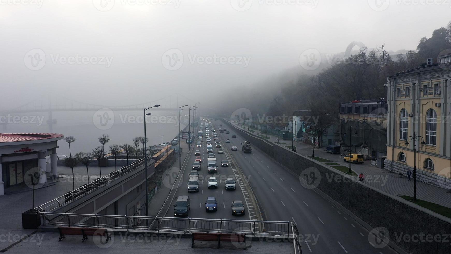 A city covered in fog. City traffic, aerial view photo