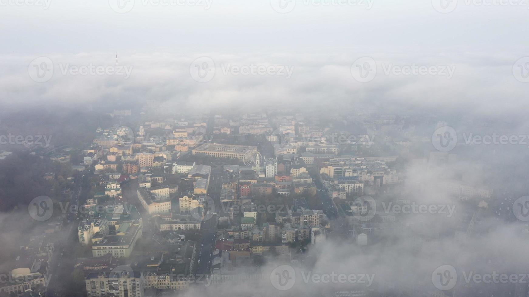 Aerial view of the city in the fog photo