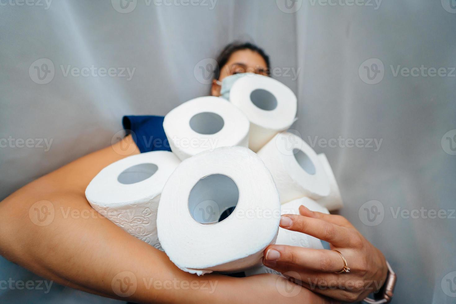 People are stocking up toilet paper for home quarantine from crownavirus. photo