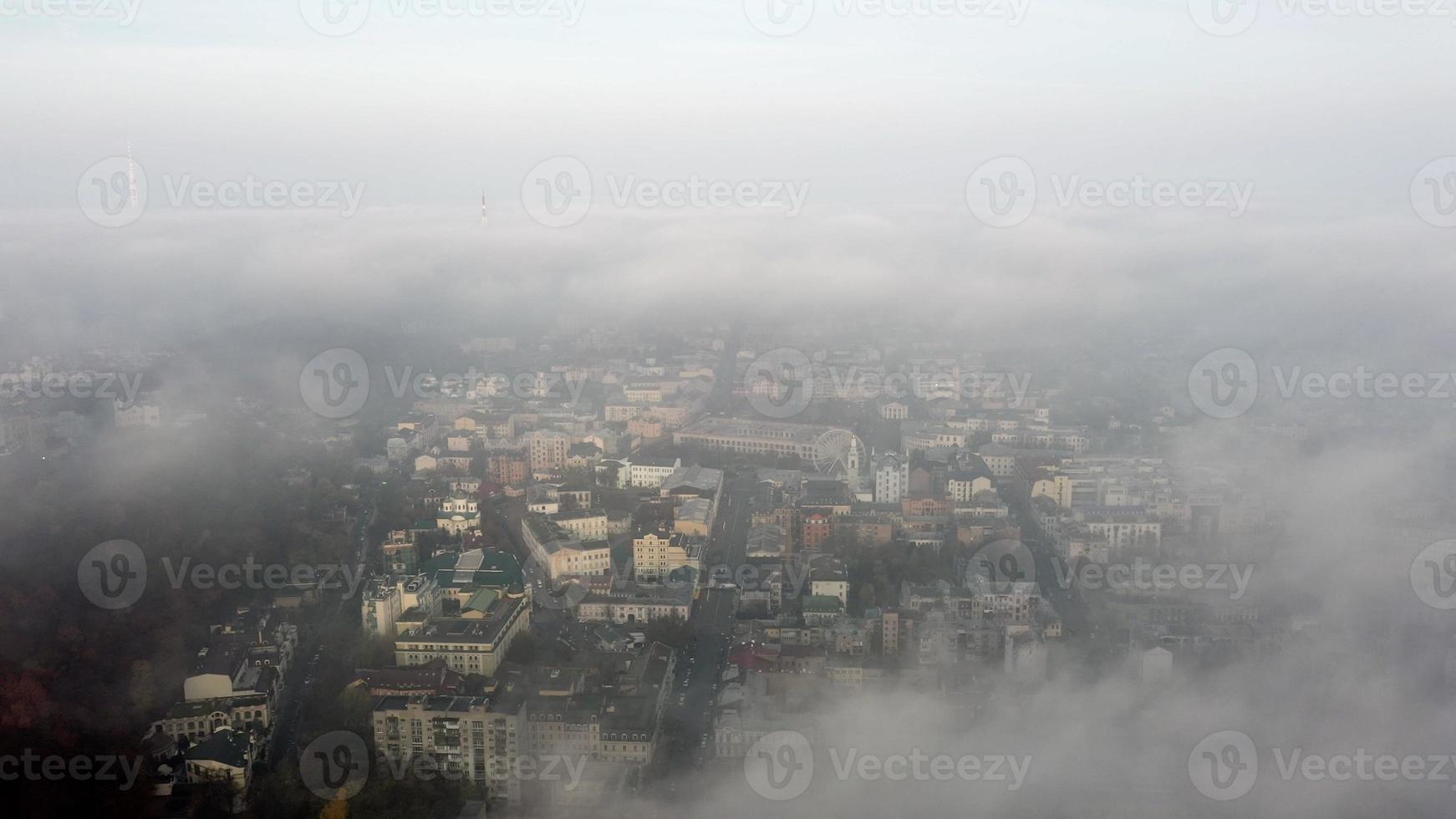 Aerial view of the city in the fog photo
