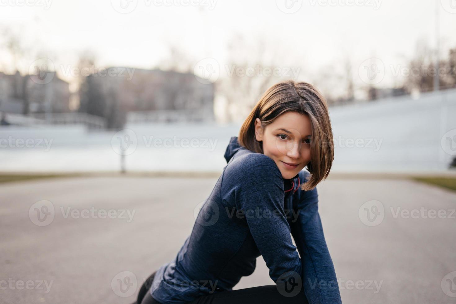 Portrait of cheerful woman posing for camera. photo