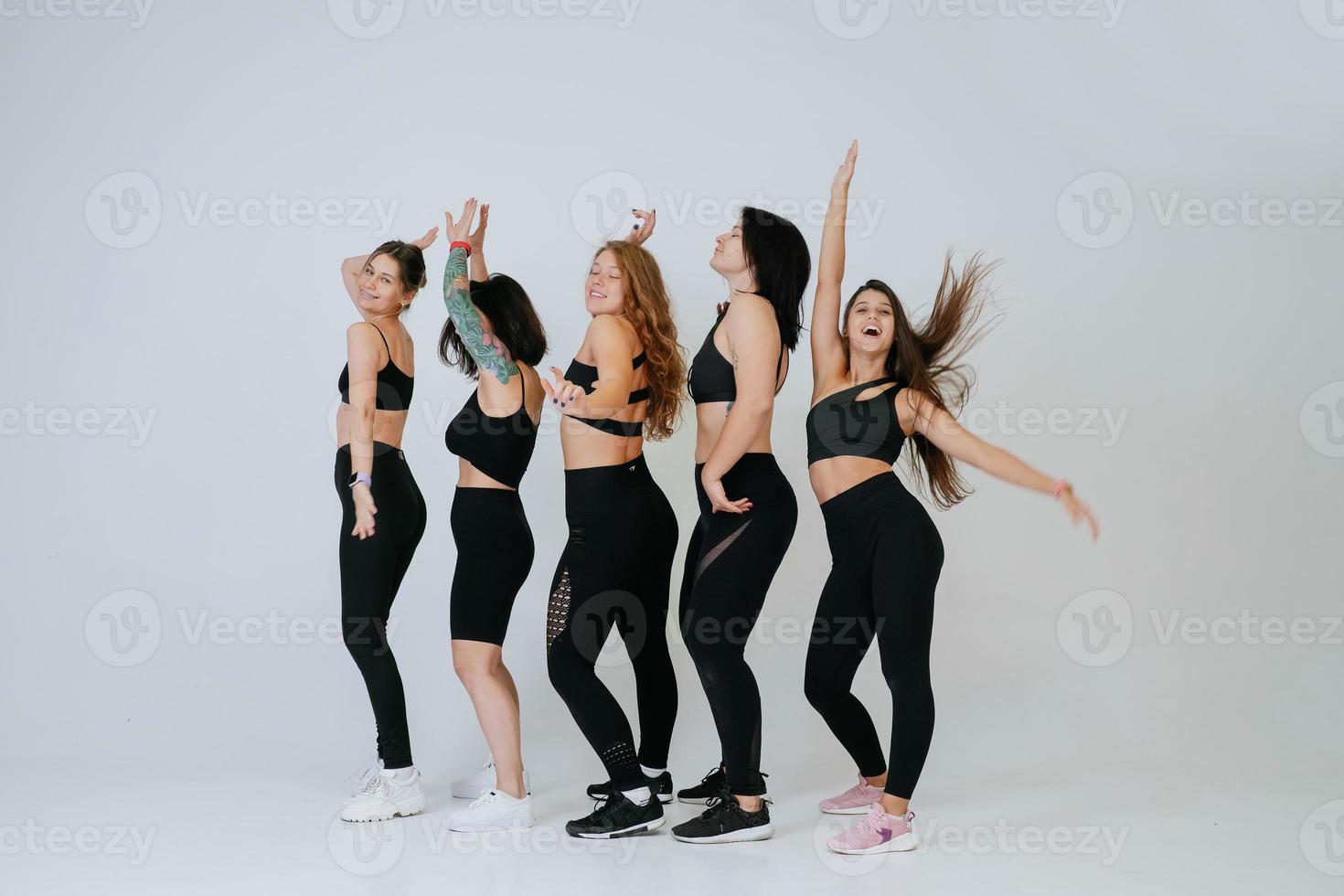 diverse models laughing, enjoying time together, look at camera photo