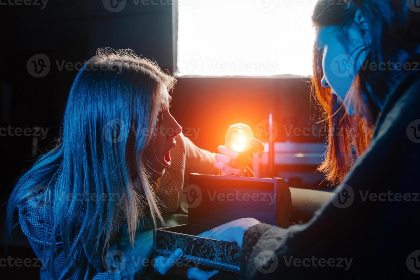 Woman and woman fortune teller with crystal ball photo