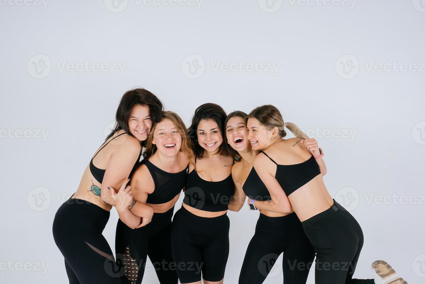 diverse models laughing, enjoying time together, look at camera photo