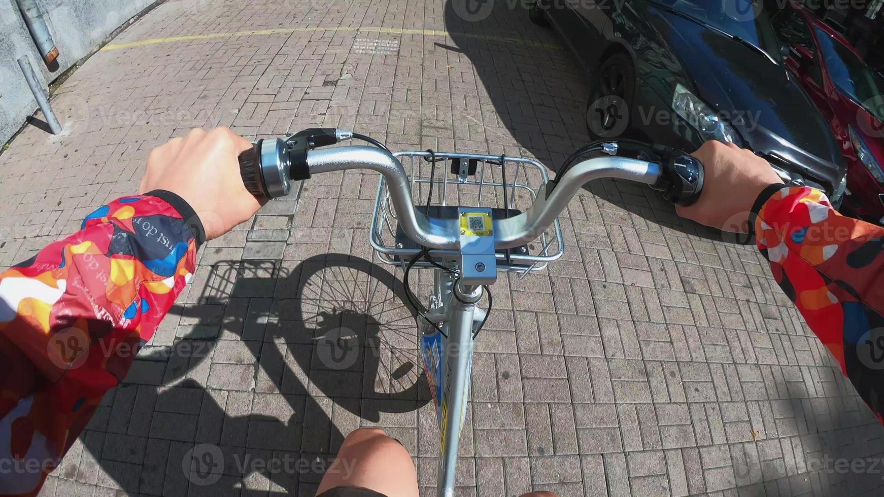 A view from the first person to the steering wheel, hands and road. photo