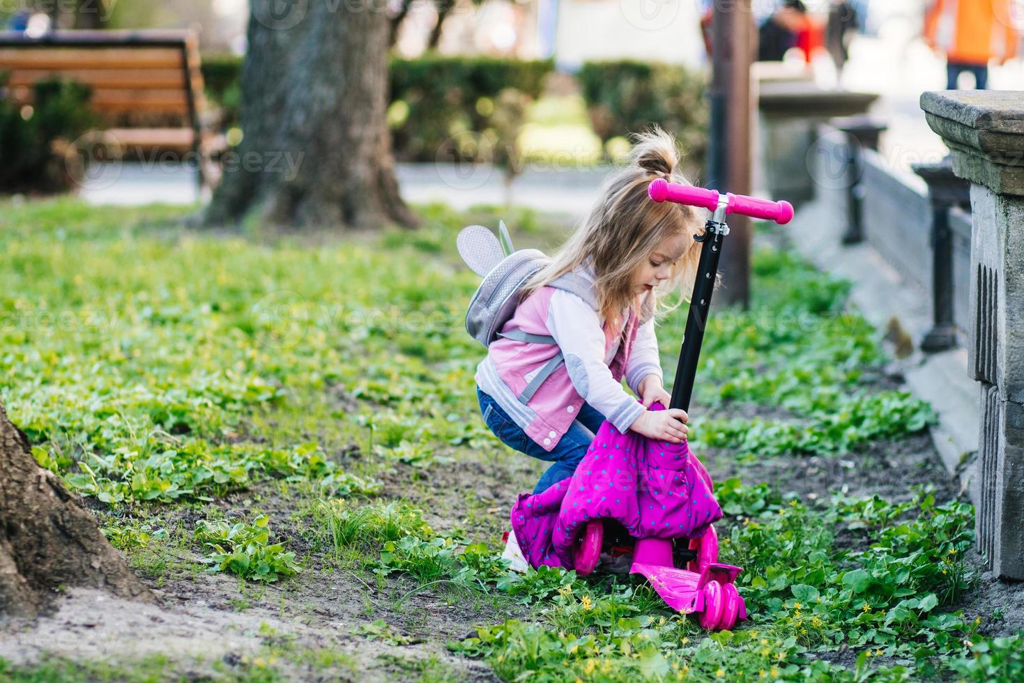 Little girl walking in the park photo