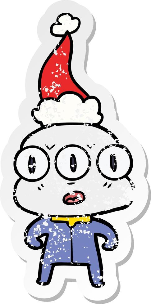 distressed sticker cartoon of a three eyed alien wearing santa hat vector