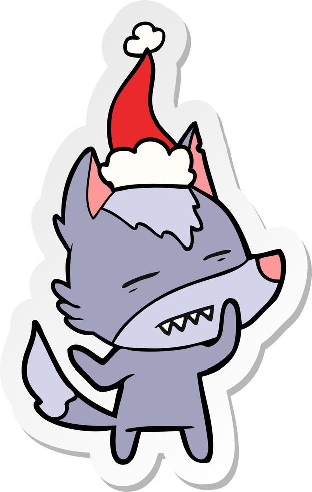 sticker cartoon of a wolf showing teeth wearing santa hat vector