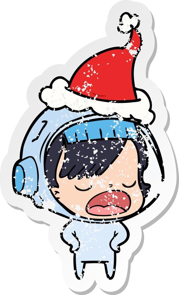 distressed sticker cartoon of a astronaut woman explaining wearing santa hat vector