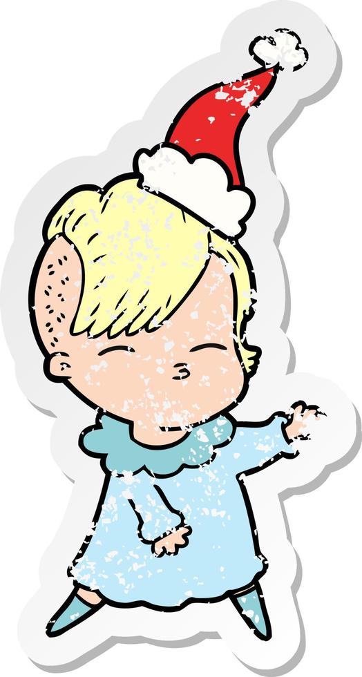 distressed sticker cartoon of a squinting girl wearing santa hat vector