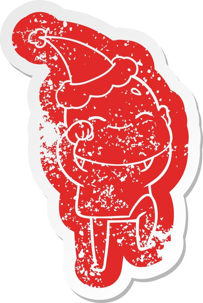 happy cartoon distressed sticker of a bald man wearing santa hat vector