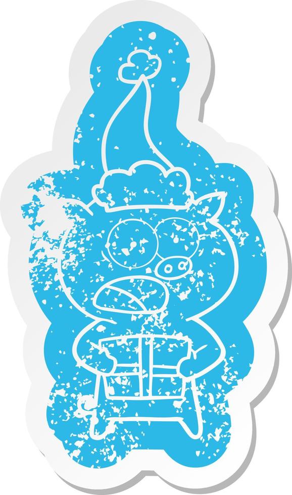 cartoon distressed sticker of a pig with christmas present wearing santa hat vector