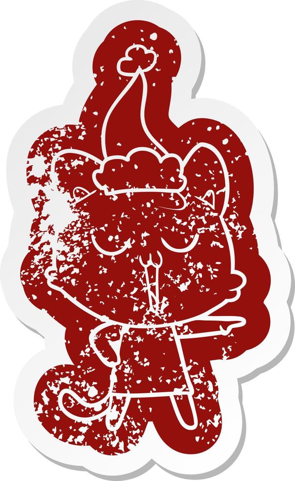 cartoon distressed sticker of a cat singing wearing santa hat vector