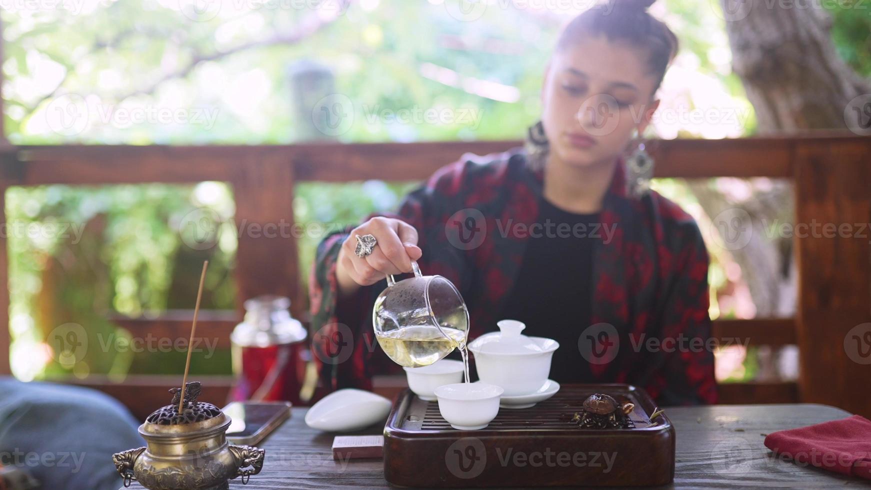 Process brewing tea. Woman steeping herbal tea photo