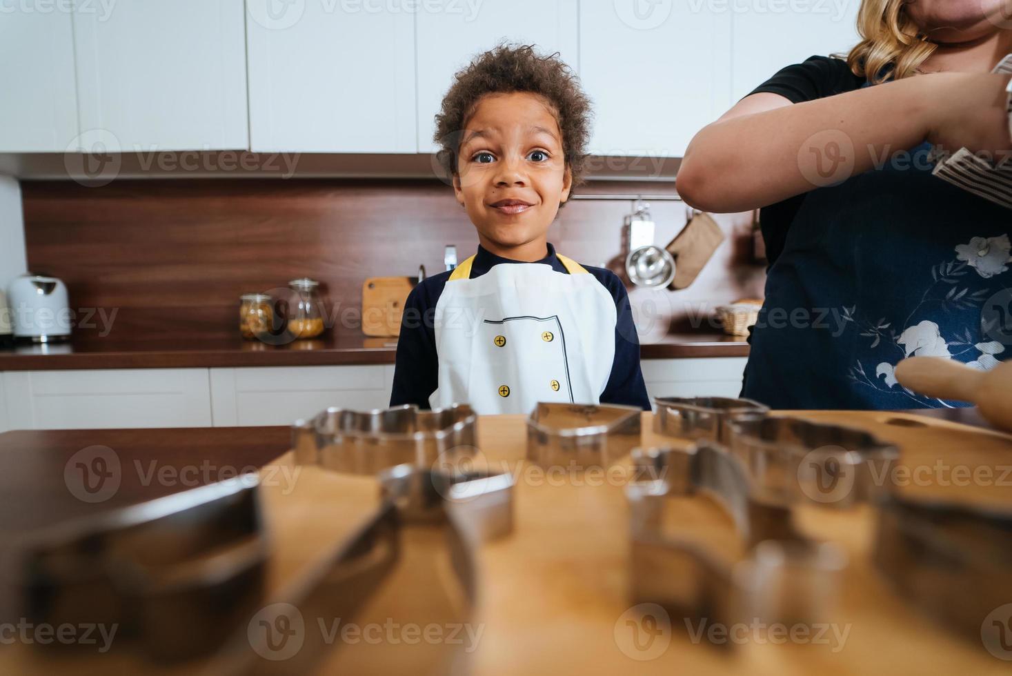 Mom and daughter prepare a baking dish photo