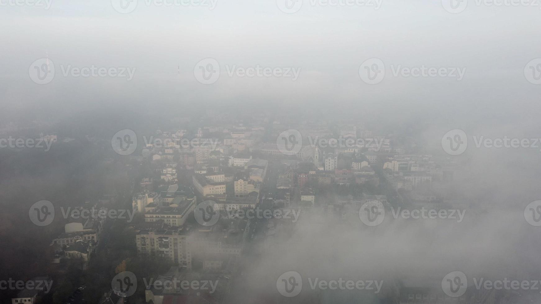 Aerial view of the city in the fog photo