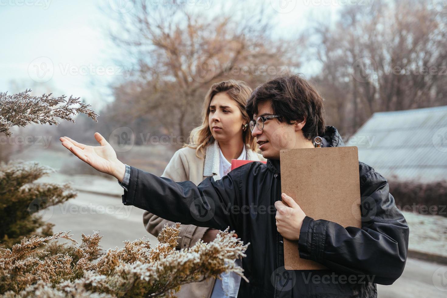 Scientists are studying plant species in the forest. photo
