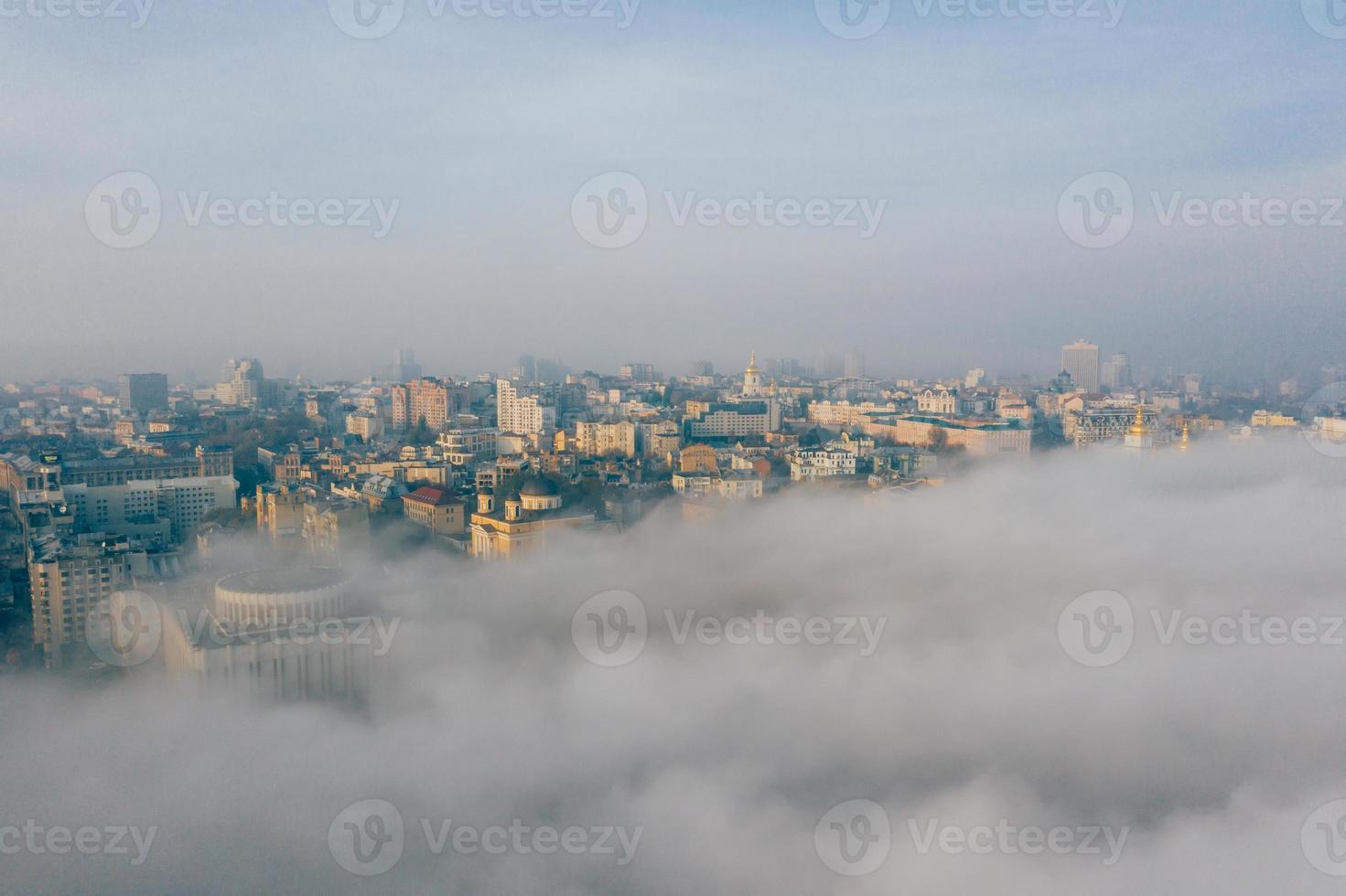 Aerial view of the city in the fog photo