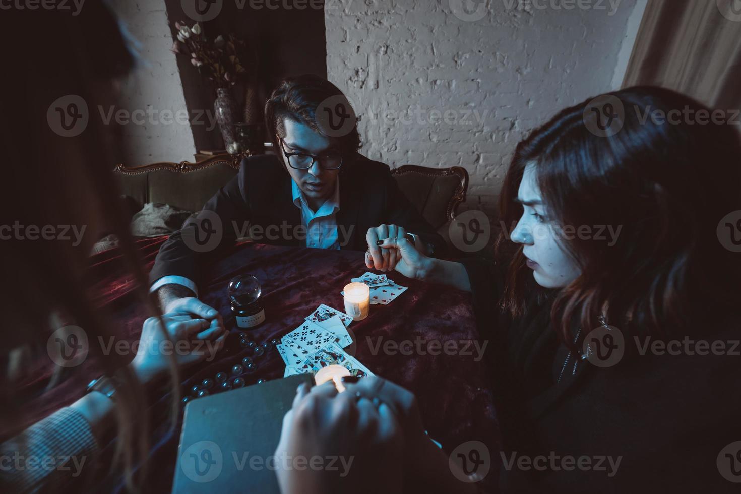 People hold hands of night at table with candles photo