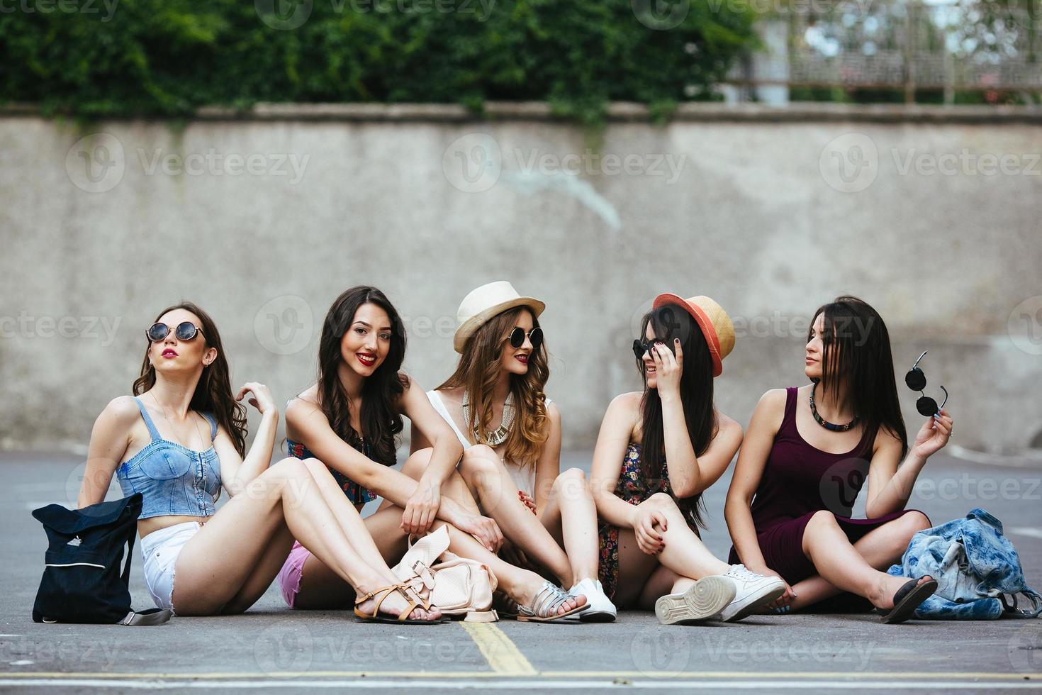 Five beautiful young girls relaxing photo