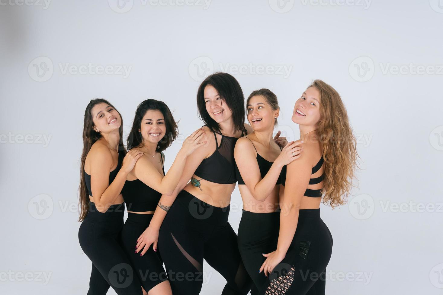 diverse models laughing, enjoying time together, look at camera photo