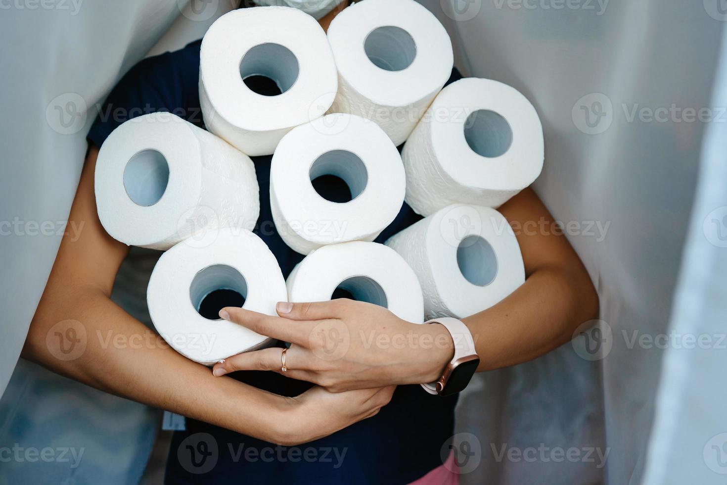 People are stocking up toilet paper for home quarantine from crownavirus. photo