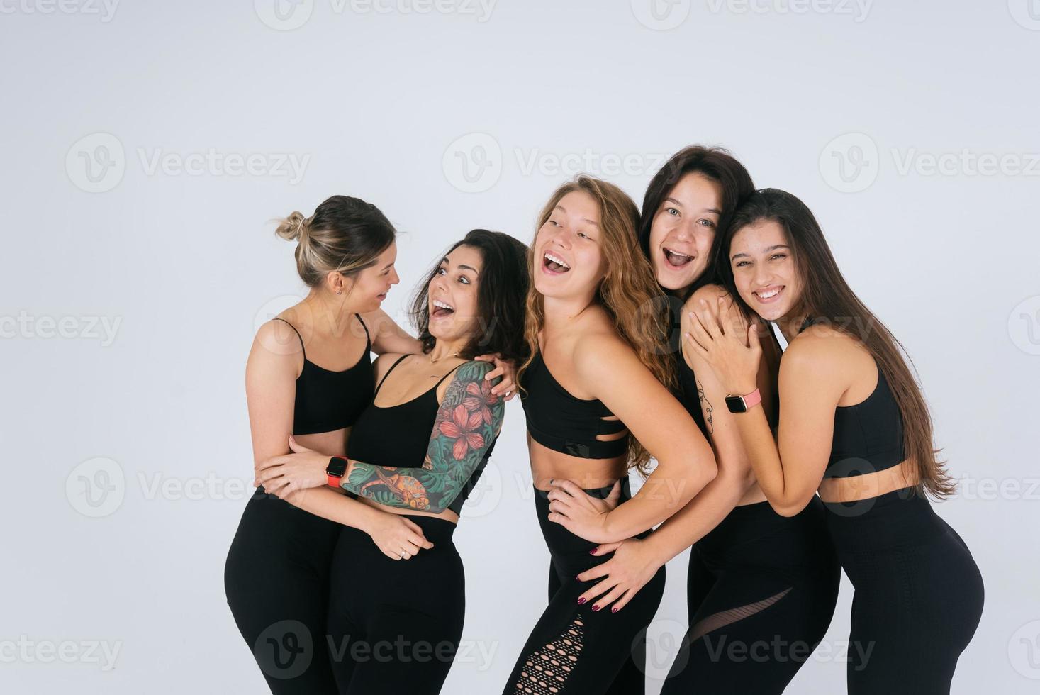 diverse models laughing, enjoying time together, look at camera photo