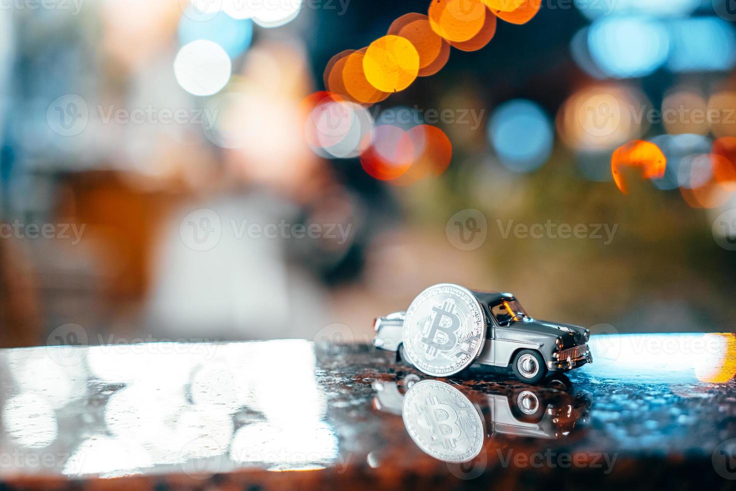 Silver bitcoin and Moskvich 401 on the table, glowing background photo