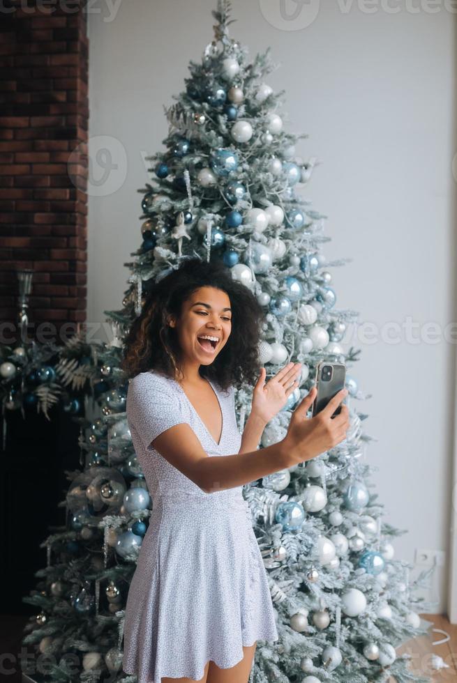 Woman Making Video Message or Selfie Concept of Holidays. photo