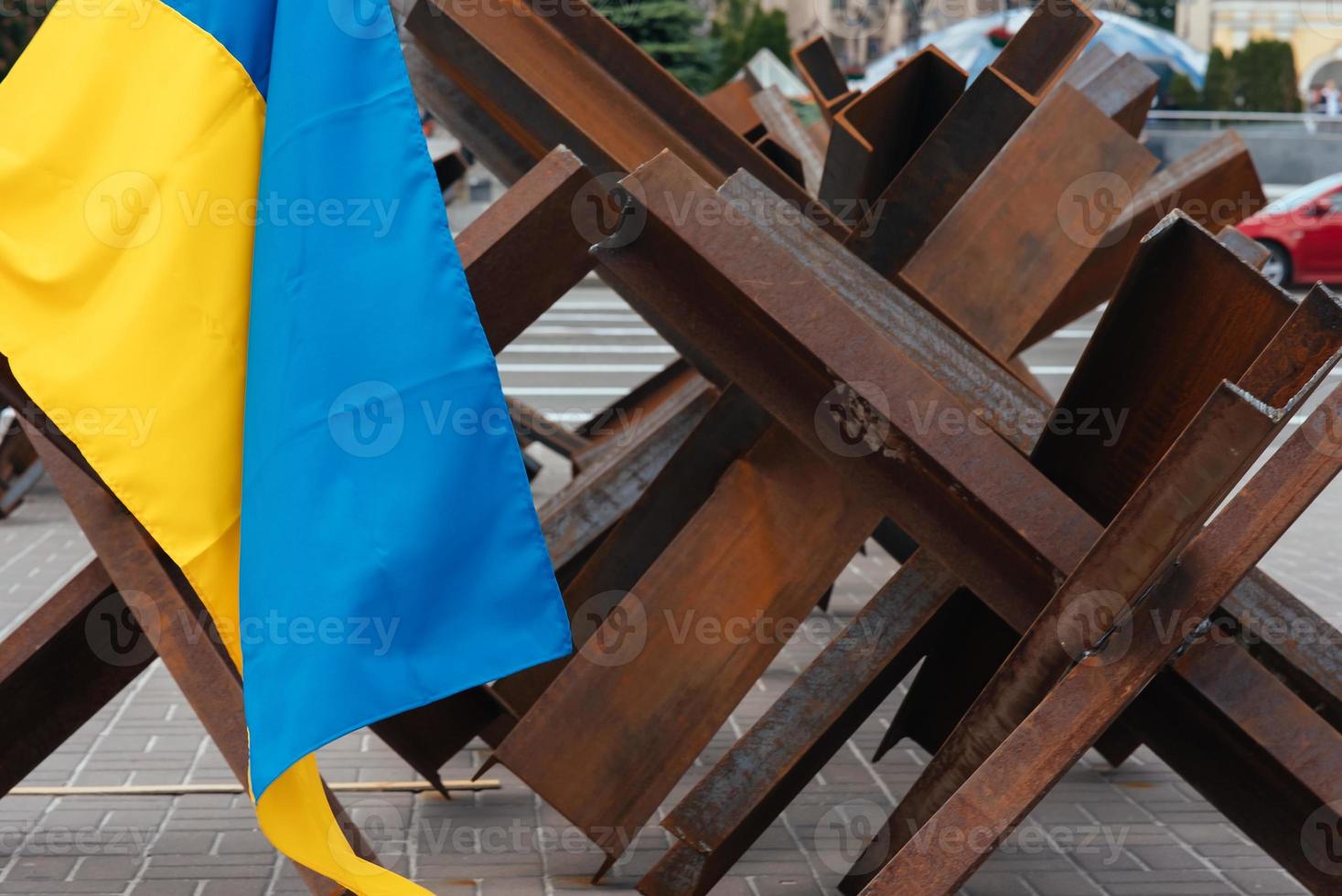 The Ukrainian flag hangs on barricades in the city photo